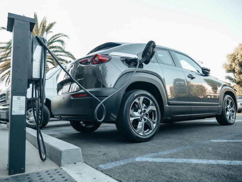 SUV charging at a commercial DC fast-charging station